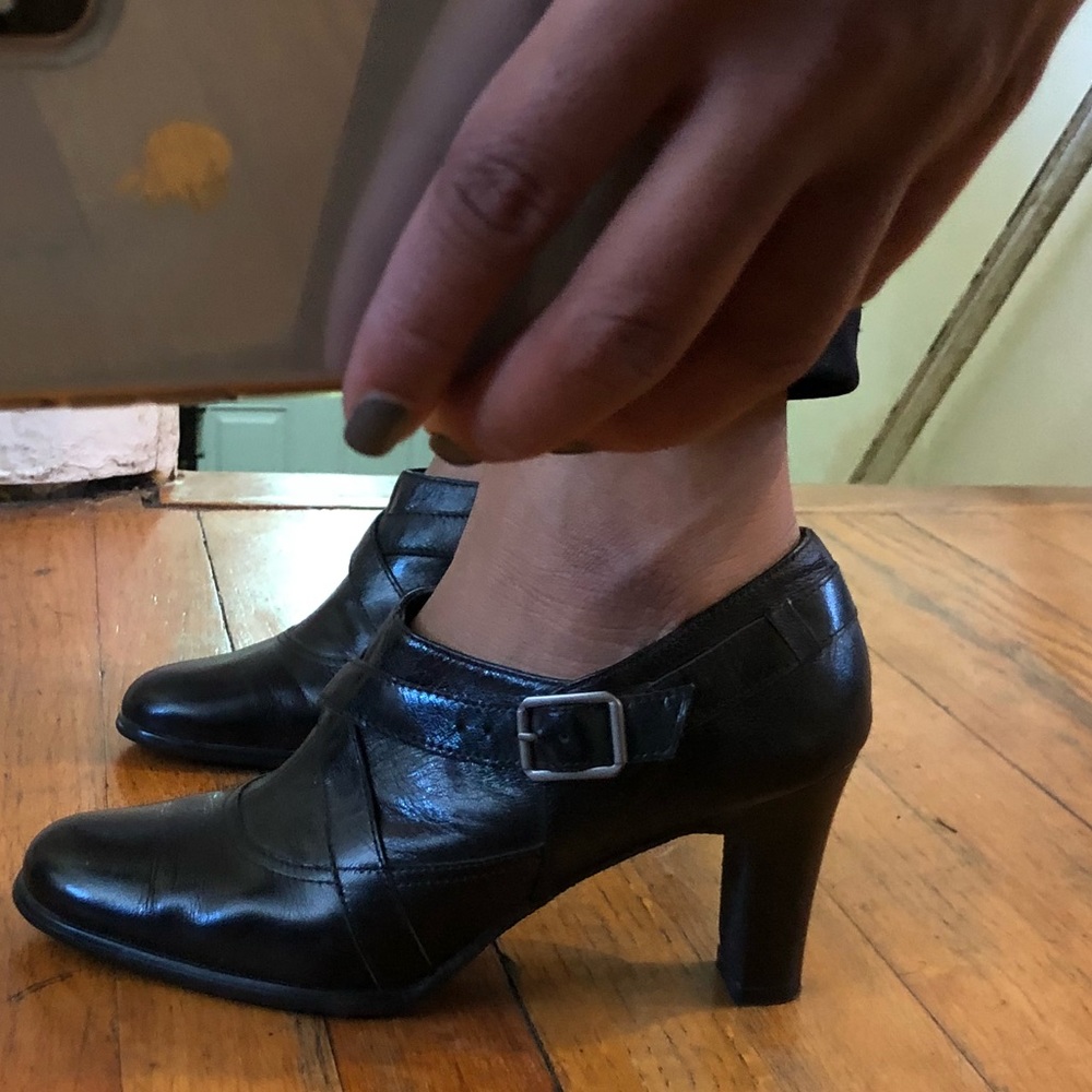 Black ankle heeled booties.